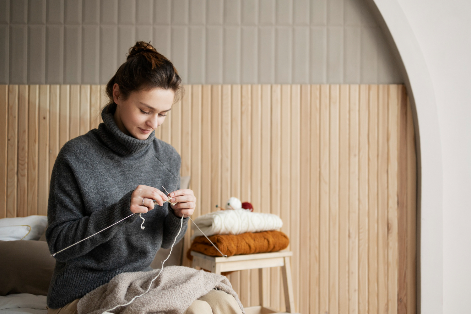 medium-shot-woman-knitting-home